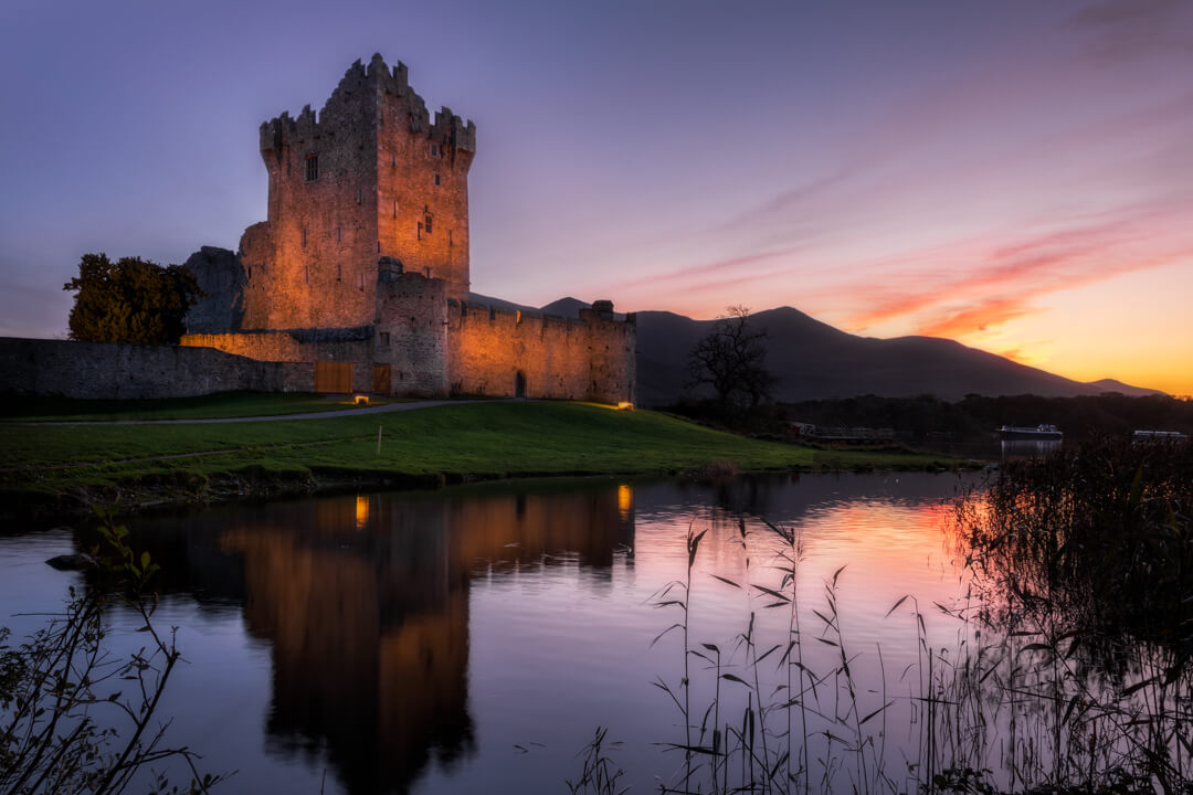 15th-century tower during a colorful twilight